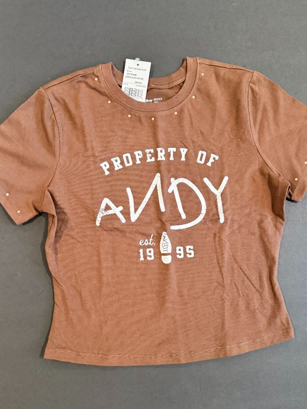 Share Official Disney Parks Toy Story "Property of Andy" Brown Crop Top Shirt